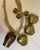 Vintage set of cowbells from the country of Lichtenstein. The three small bells are handpainted with flowers. Hung on a...