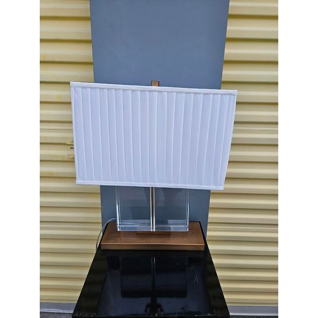 This is very likely a Sloan Table Lamp by Robert Abbey but it's not marked. In very good condition all around. Features a...