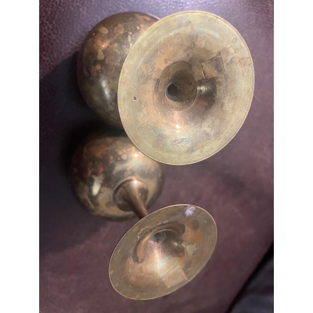 A charming pair of vintage etched brass goblets featuring intricate floral engravings and a warm, aged patina. These...