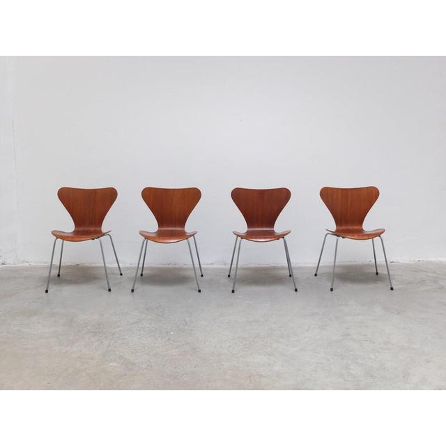 Original set of 8 ‘Series 7’ dining chairs designed by Arne Jacobsen in 1955. Beautiful teak wood version from 1991 which...