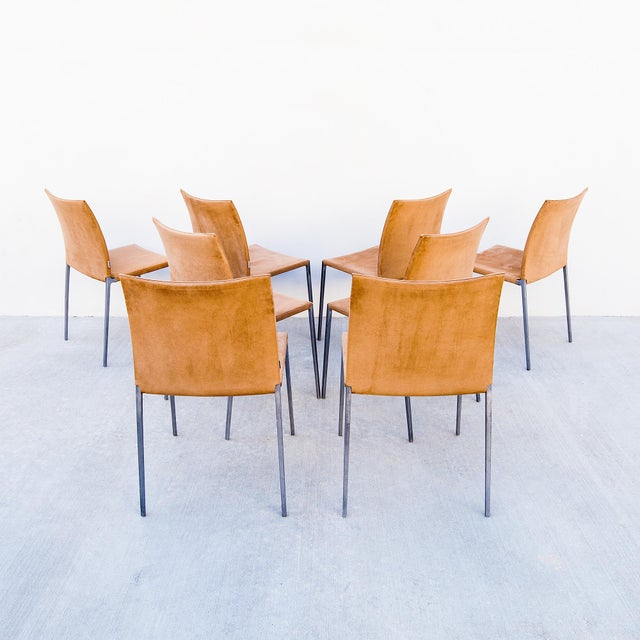 Set of eight suede dining chairs by Roberto Barbieri, made by Zanotta in Italy in 2005. The "Lia" chair consists of a...