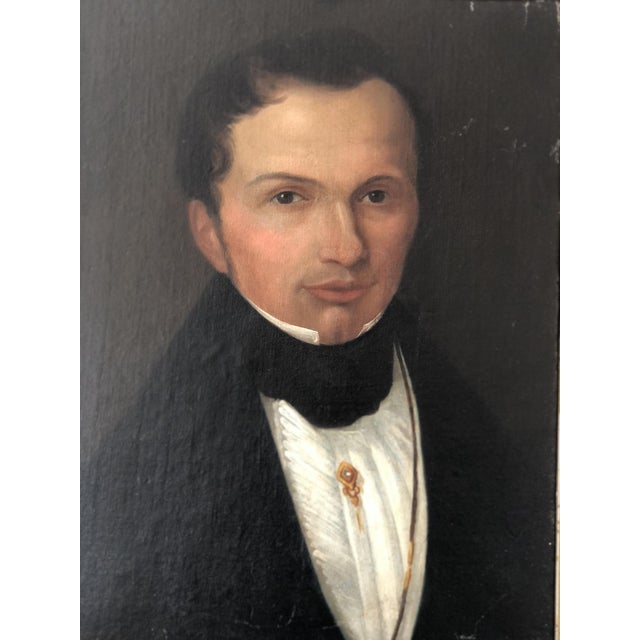 This antique vintage oil portrait painting from the 19th century shows a Dutch gentleman formally dressed. He wears a...