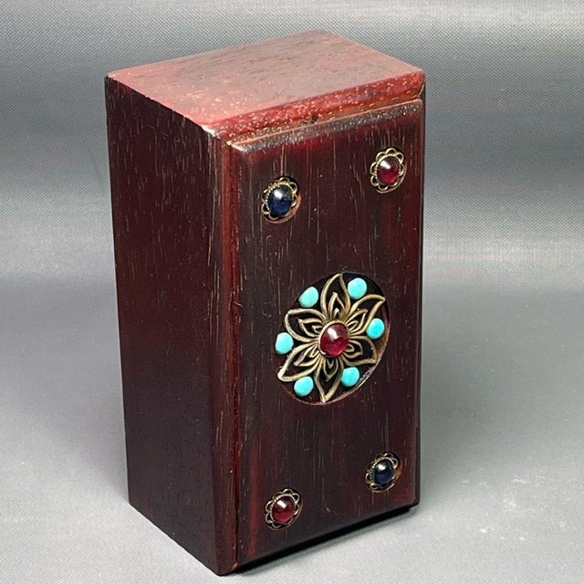 A hand-crafted wooden sliding drawer box with an antique-inspired character. The exterior is decorated with delicate metal...