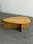 W47 D32 H16.5 This contemporary coffee table in solid oak was lightly refinished. It has an architectural tear drop shape...