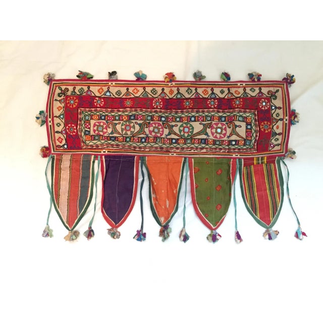 A vintage hand-embroidered mirrored cotton door or window valance with ribbon tassels. One of a kind. Purchased in Jaipur,...