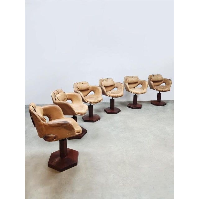 You don't often come across these rare leather swivel bucket chairs. Period: 1950s. This set is beautifully designed....