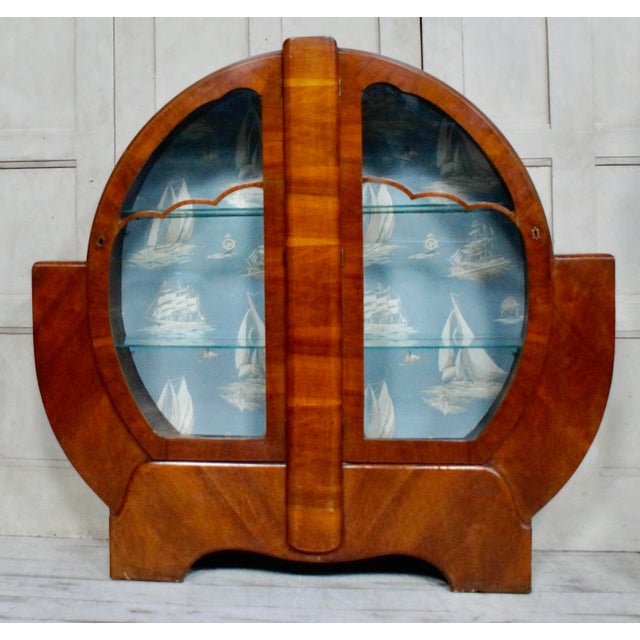 Art Deco Walnut Circular Display Cabinet. Made from Walnut & Beech, of circular form with a shelf to each side...