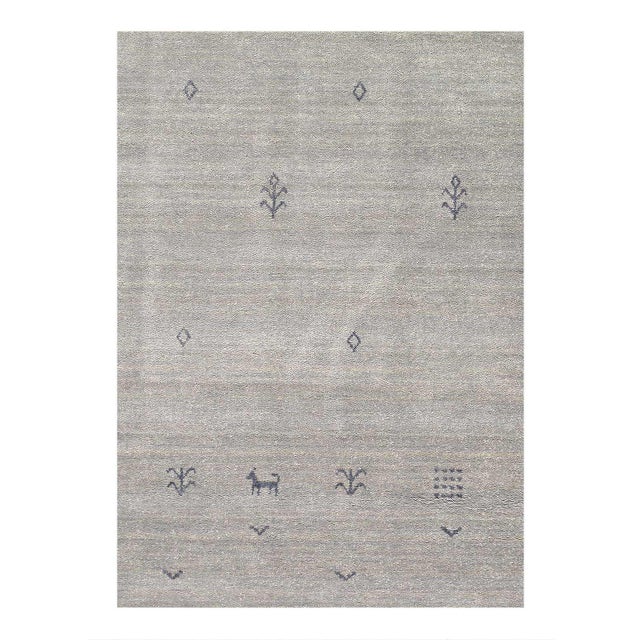 Gabbeh rugs are made by the nomadic Qashqai tribes of southern region. They are rough cut and long piled rugs of rich...