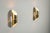This pair of vintage wall lamps features an elegant brass design with a distinctive cylindrical shade. Each cylinder is...