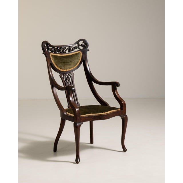 A refined armchair crafted in mahogany, a favored material in 19th century British furniture due to its durability and...
