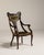 A refined armchair crafted in mahogany, a favored material in 19th century British furniture due to its durability and...