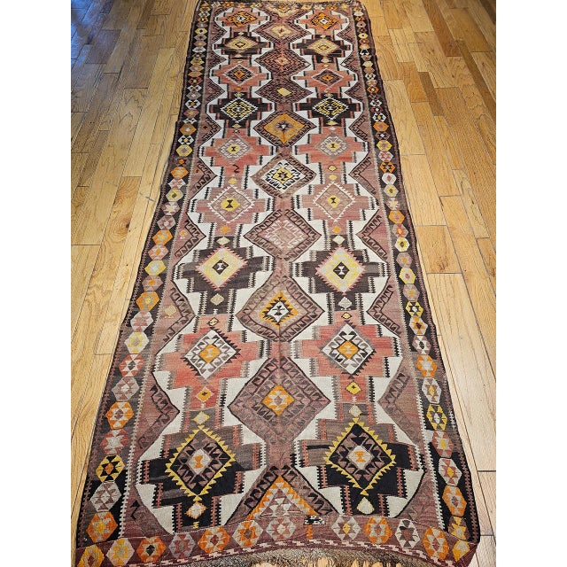 Woven in Eastern Anatolia in the early years of the 20th century, this vintage Kurdish kilim carries a design vocabulary...