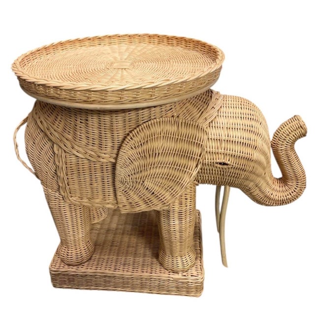 Bring bohemian warmth and iconic vintage style into your home with this handcrafted wicker elephant accent table. Designed...