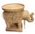 Bring bohemian warmth and iconic vintage style into your home with this handcrafted wicker elephant accent table. Designed...