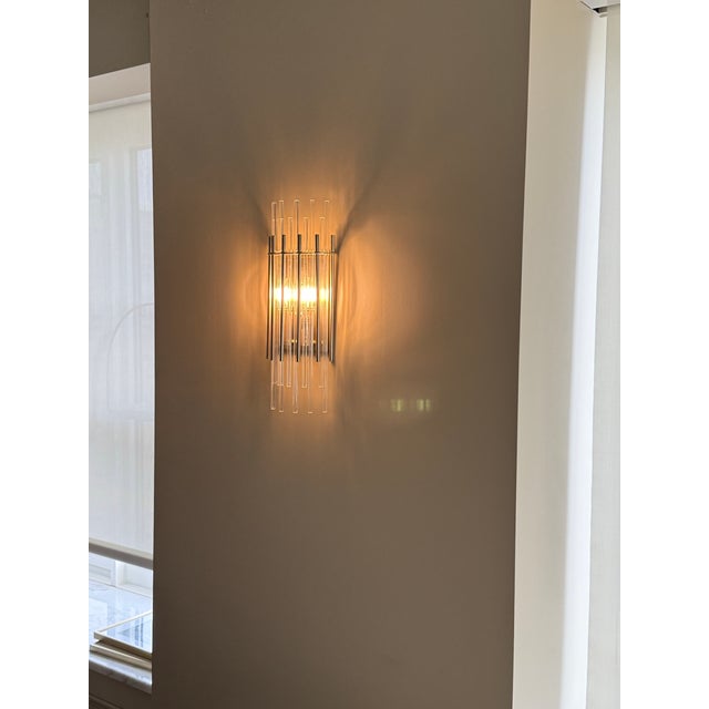 Discover an intriguing interplay of light and form with the Wallis Wall Sconce, a fixture that offers a truly unique...