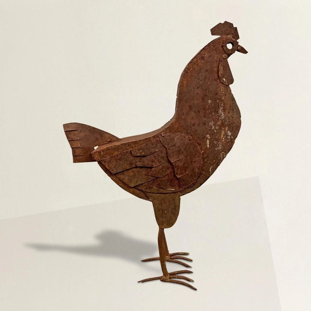 A mischievous 20th century American folk art rooster sculpture with a wonderful disposition, and beautiful rusted finish....