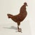 A mischievous 20th century American folk art rooster sculpture with a wonderful disposition, and beautiful rusted finish....