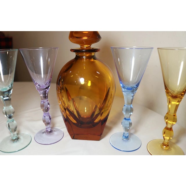 Up for sale is a very high quality signed Moser colored crystal decanter set. This exquisite set consists of 5 pieces...