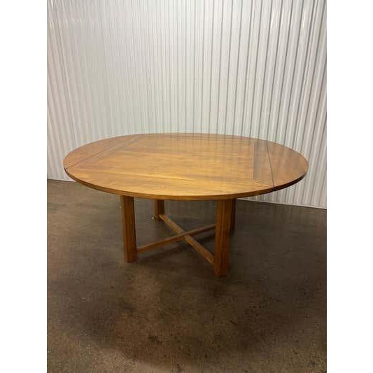 Wood Square Table in a light walnut stain. This table does double duty! As a square table it is 46.5 round. Fold up on...