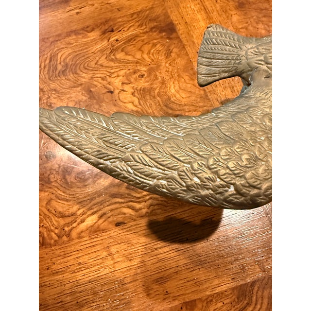 Vintage Brass Eagle perched on a branch with its wings partially extended. Great Item for bird enthusiasts and Americana...