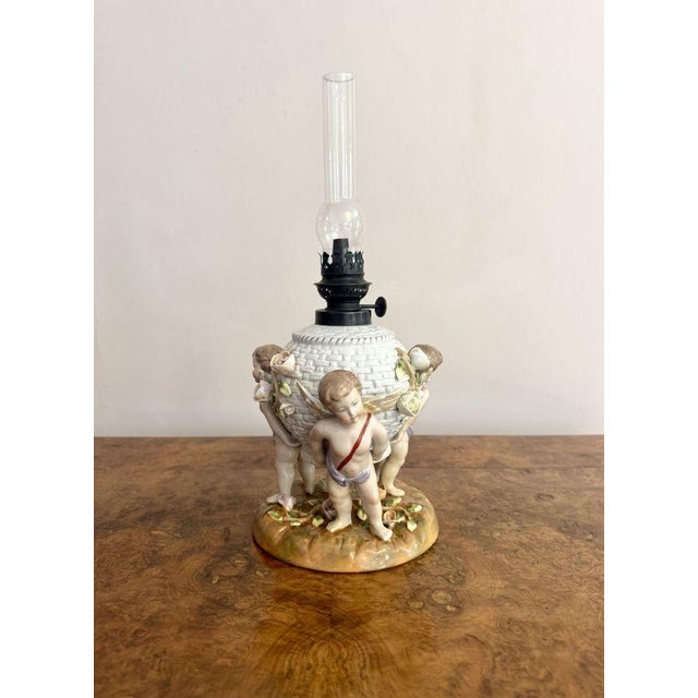 Outstanding quality antique Sitzendorf porcelain oil lamp, having a quality antique Sitzendorf oil lamp with the original...