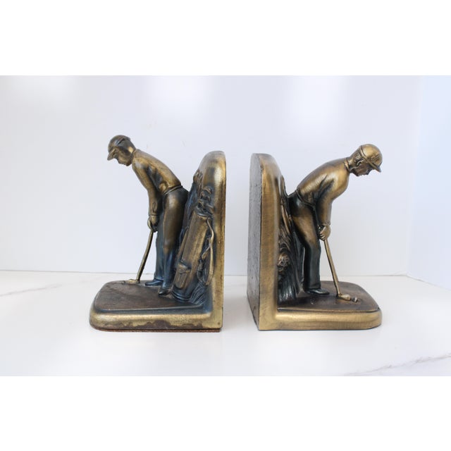 Brass Mid Century Golf Player Bookends, nicely weighted with aged patina throughout.
