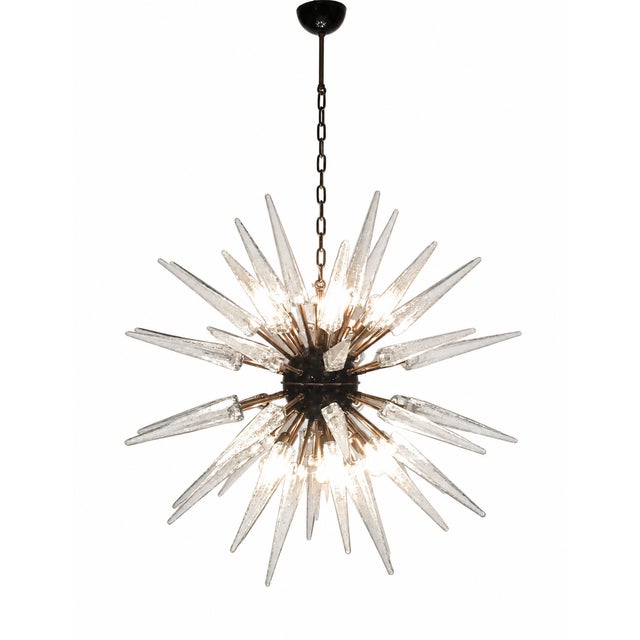 Italian Sputnik chandelier offered by Justfurnituress, featuring 51 pointed clear glass elements arranged in a radial...