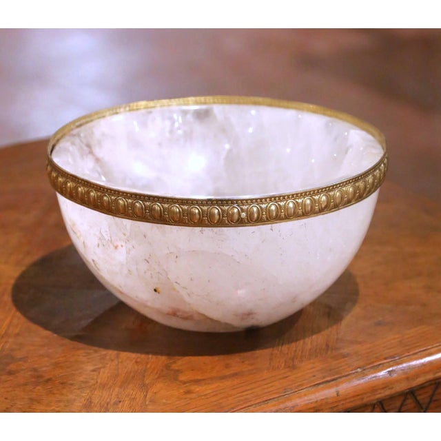 Crafted in Brazil, this elegant hand carved rock crystal bowl features a substantial round form with a deep basin and...