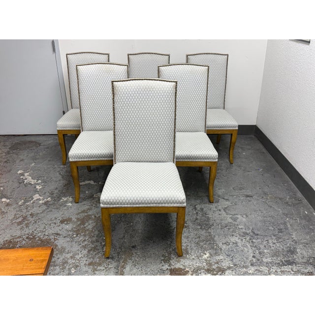 Design Plus Gallery presents a Set of Six Custom Collection Dining Chairs from Lockhart Furniture. The tall, upholstered...