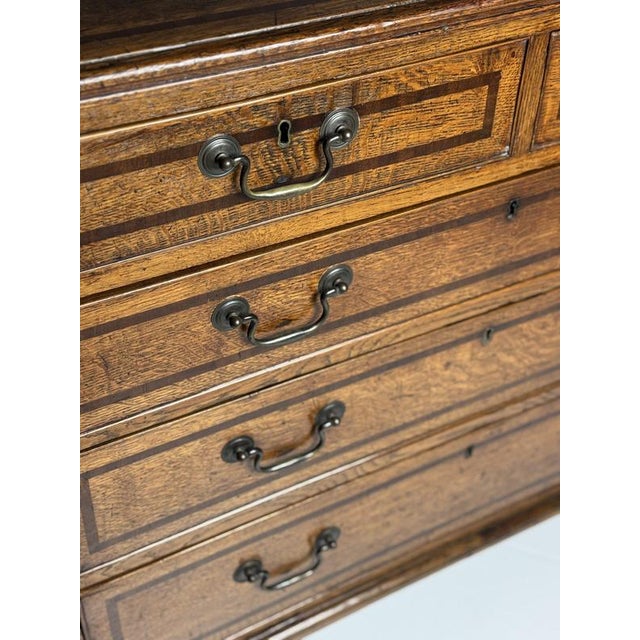 English chest of drawers. Georgian, ca. 1780. Made of solid oak. Inlaid with mahogany. In very good condition. with...