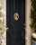 A handsome vintage cast brass door knocker featuring a sculptural horse head framed within a classic horseshoe. The...