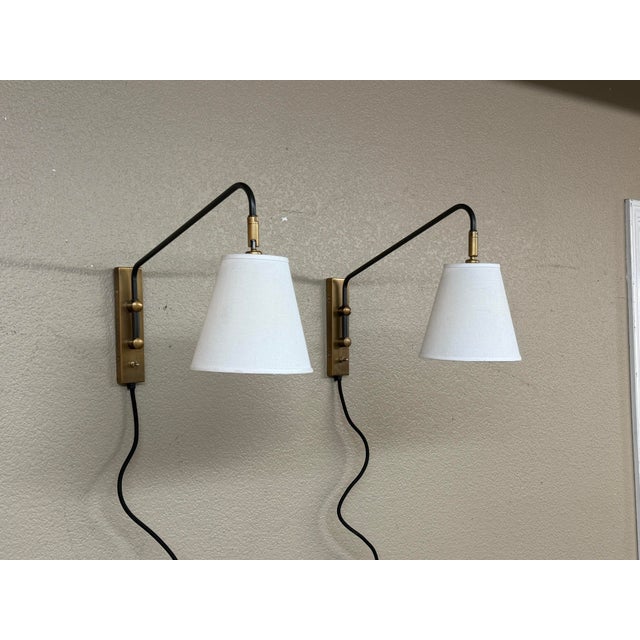 Design Plus Gallery presents a Pair of Flynn Wall Sconces from Serena & Lily. The sconces have a vintage pharmacy-...