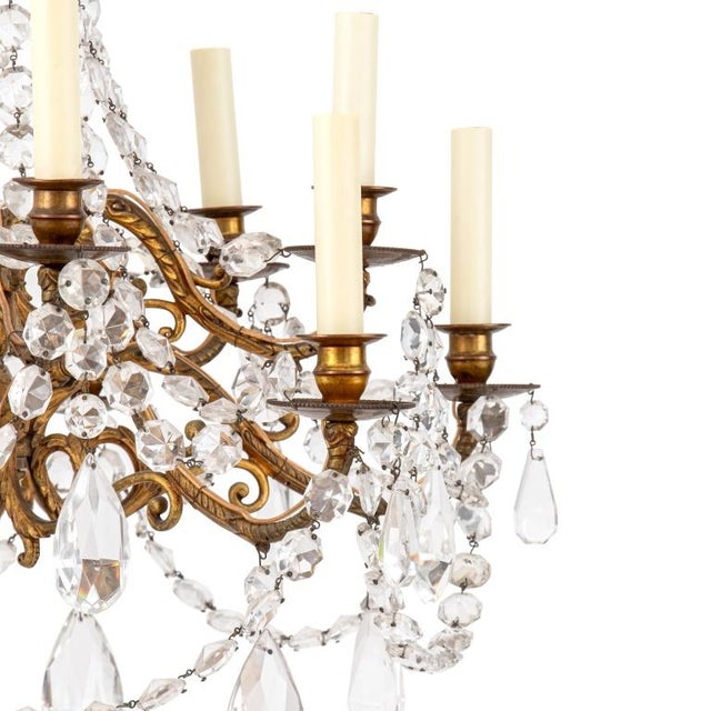 Italian Empire Style Ten-Light Gilt Metal Crystal Chandelier, with suspended crystal canopy and swags with drop crystal...