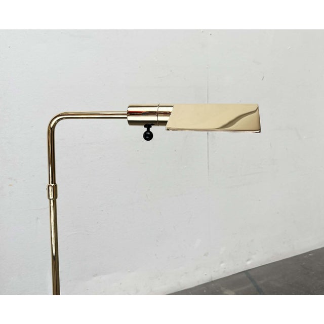Rare floor lamp by Cedric Hartman, produced in Switzerland for Jack Lenor Larsen. The design impresses with its...