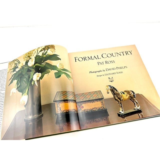 Formal Country" by Pat Ross, with photographs by David Phelps, merges the sophistication of formal design with the rustic...