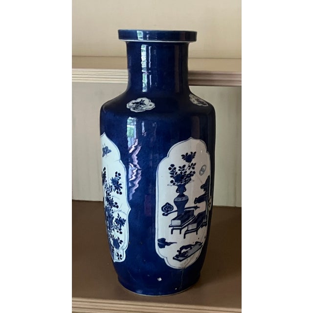 Antique early 18th century Chinese powder blue Kangxi Period porcelain rouleau vase circa 1700. Decorated with four panels...