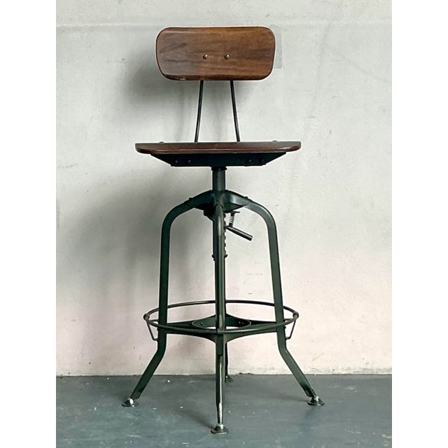 Embrace the robust charm of this vintage Boho Industrial Adjustable Swivel Stool, a perfect blend of utilitarian design...