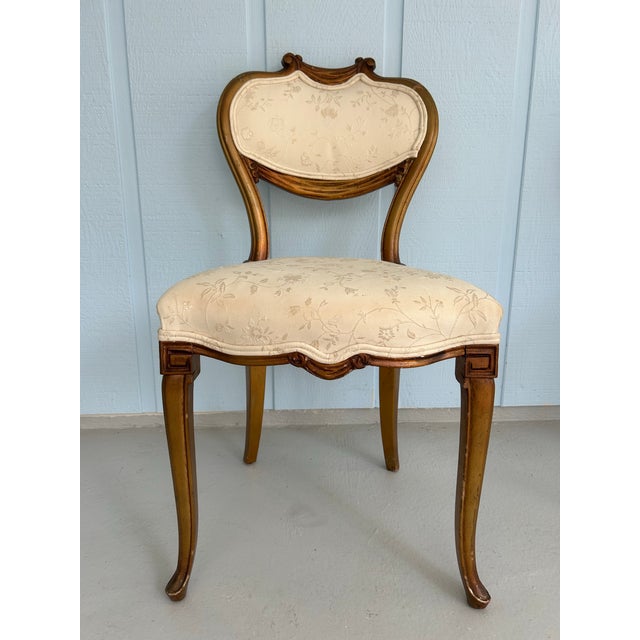 A rare and striking pair of 19th century French side chairs in the Transitional Louis XV–XVI manner, notable for their...