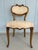 A rare and striking pair of 19th century French side chairs in the Transitional Louis XV–XVI manner, notable for their...