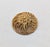 1960s goldtone round domed flower center with wire spiral surround brooch with security clasp. Marked "NAPIER©" on a...