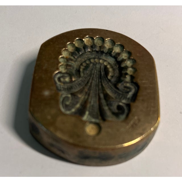 Antique French button mold paper weight in what appears to be an octopus design. Very unusual.