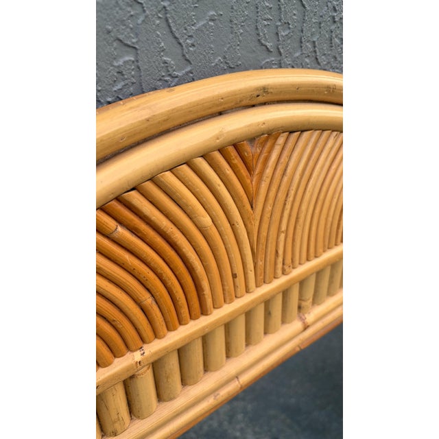 This is a large all pencil reed wall mirror. The mirror sits features side columns. This has great size and it would be...