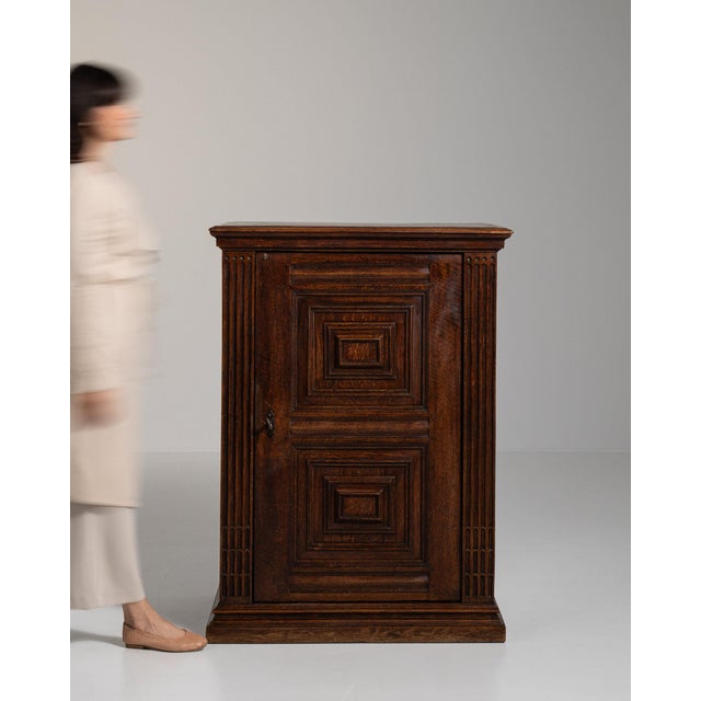 This side cabinet makes its impression through dark walnut, 2 doors. Dating to 19th Century and originating from France,...