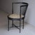 Corner chair from the 1940s. Austrian production attributed to Adolf Loos. Black lacquered wood frame and fabric seat. In...