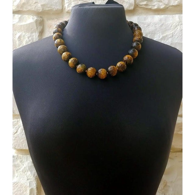 Celebrate the timeless beauty of natural gemstones with this exceptional Vintage Carved Tiger's Eye Necklace, handcrafted...