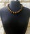 Celebrate the timeless beauty of natural gemstones with this exceptional Vintage Carved Tiger's Eye Necklace, handcrafted...