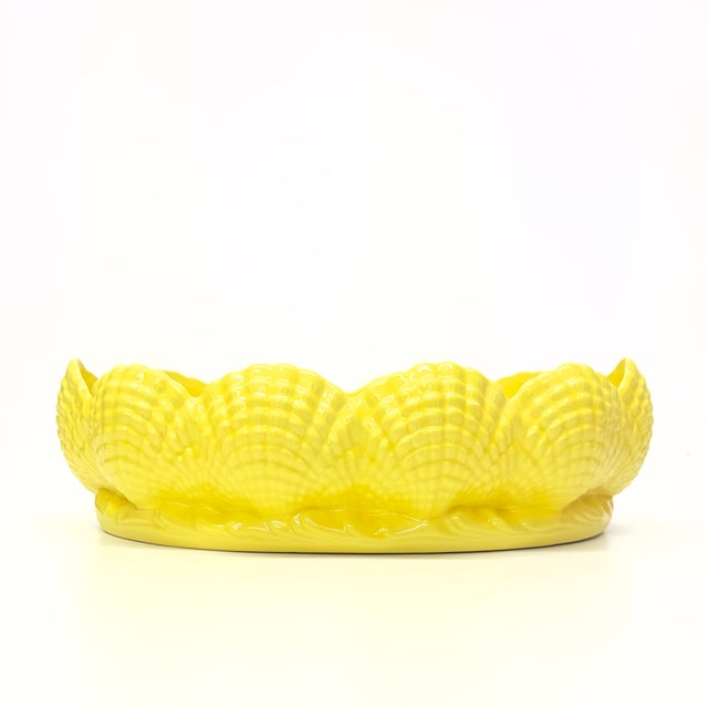 Yellow ceramic bowl. This is a stunning Mid-Century lemon-yellow ceramic shell motif serving bowl. 12.5"W x 9.5"D x 3.5"H
