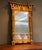 A beautiful split-panel giltwood mirror with interesting provenance! This piece come from the Moss Acre Estate in Maine....
