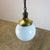 Circa 1930. We offer this Art Deco pendant light made in milk glass circular shade rare blue color. Great patina and...