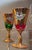 A dazzling set of four vintage Venetian wine glasses, handmade in Italy and presented in four rich jewel tones: cobalt...